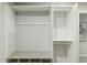 Mudroom with convenient storage shelves and coat hooks at 8719 E San Marcos Dr, Scottsdale, AZ 85258
