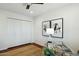 This office has a ceiling fan, hardwood floors, abstract art and a glass desk at 8719 E San Marcos Dr, Scottsdale, AZ 85258