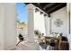 Cozy outdoor patio featuring stylish seating, decorative pillars, and tranquil natural light at 8719 E San Marcos Dr, Scottsdale, AZ 85258