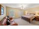 Cozy bedroom featuring neutral tones, soft carpet, and a comfortable seating area at 9019 N 87Th Way, Scottsdale, AZ 85258