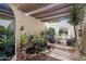 Picturesque courtyard boasting a tranquil pond, lush greenery, and arched access with comfortable patio seating at 9019 N 87Th Way, Scottsdale, AZ 85258