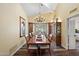 Dining room with high ceilings, chandelier, and large table, ideal for gatherings and formal dining at 9019 N 87Th Way, Scottsdale, AZ 85258