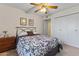 Cozy bedroom featuring a bed, ceiling fan, and closet space, perfect for relaxation at 9202 N 107Th Ave, Sun City, AZ 85351