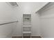 Well-organized walk-in closet with built-in shelving, offering ample storage solutions at 9202 N 107Th Ave, Sun City, AZ 85351