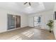 Bright sunroom with tile floor, ceiling fan, and skylights offers a cozy space for relaxation at 9202 N 107Th Ave, Sun City, AZ 85351