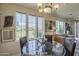 Cozy dining area with a glass table, wicker chairs, and plenty of natural light at 10655 N 9Th St # 115, Phoenix, AZ 85020
