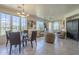 Bright open-concept living room featuring large windows and comfortable seating with backyard view at 10655 N 9Th St # 115, Phoenix, AZ 85020