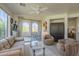 Bright and spacious living room with neutral tones and access to the outdoor patio at 10655 N 9Th St # 115, Phoenix, AZ 85020