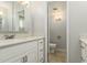Bathroom featuring a white vanity and a view into the toilet room at 1240 E Indigo St, Mesa, AZ 85203