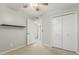 Bedroom with neutral walls, closet, and ceiling fan at 1240 E Indigo St, Mesa, AZ 85203