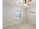 Bedroom features a window, ceiling fan, and neutral walls at 1240 E Indigo St, Mesa, AZ 85203