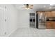 Kitchen with stainless steel refrigerator and a view into the laundry room at 1240 E Indigo St, Mesa, AZ 85203
