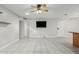 Open living room with tiled flooring, ceiling fan, and direct access to other rooms at 1240 E Indigo St, Mesa, AZ 85203