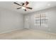 Inviting living room featuring neutral paint, carpet flooring and a front door view at 1240 E Indigo St, Mesa, AZ 85203