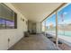Covered patio features views of sparkling pool with rock landscaping and privacy screen at 1240 E Indigo St, Mesa, AZ 85203