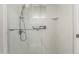 Contemporary shower with sleek fixtures, a clear glass door and marble-like tile at 1240 E Indigo St, Mesa, AZ 85203