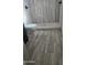 Stylish bathroom boasts wood-look tile floors and a modern white toilet at 1358 S Royal Palm Rd, Apache Junction, AZ 85119