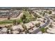 Aerial view of homes located near a golf course featuring lush green fairways at 1777 W Redfield Rd, Gilbert, AZ 85233