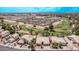 Stunning aerial view of desert homes adjacent to a golf course in a vibrant community setting at 1777 W Redfield Rd, Gilbert, AZ 85233