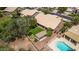 Aerial view of a backyard featuring a pool, artificial grass, and pergola at 1777 W Redfield Rd, Gilbert, AZ 85233