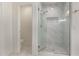 Luxurious bathroom with a glass-enclosed shower, offering a clean and modern design and an attached toilet room at 1777 W Redfield Rd, Gilbert, AZ 85233