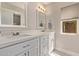 Bright bathroom with a double vanity, quartz counters, and natural light, creating a functional space at 1777 W Redfield Rd, Gilbert, AZ 85233