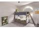 Cozy bedroom featuring a bunk bed with storage drawers and a decorative window, a charming ' room at 1777 W Redfield Rd, Gilbert, AZ 85233