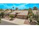 Well-kept single-Gathering home showcasing a two-car garage and desert landscaping at 1777 W Redfield Rd, Gilbert, AZ 85233