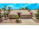 Charming single-story home with a well-manicured front yard and a two-car garage at 1777 W Redfield Rd, Gilbert, AZ 85233