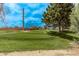 Scenic golf course view with lush green fairways and mature trees under a blue sky at 1777 W Redfield Rd, Gilbert, AZ 85233