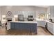 Kitchen with gray island, white perimeter cabinets, and stainless appliances at 1777 W Redfield Rd, Gilbert, AZ 85233