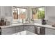 Bright kitchen sink with backyard view and stainless steel dishwasher at 1777 W Redfield Rd, Gilbert, AZ 85233