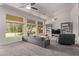 Spacious living room boasting large windows, comfortable seating, and neutral decor at 1777 W Redfield Rd, Gilbert, AZ 85233