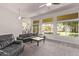 Open-concept living room featuring backyard views, neutral tones, and carpeted floors at 1777 W Redfield Rd, Gilbert, AZ 85233