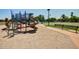 Neighborhood playground with slides, climbing structures, and benches for relaxation at 1777 W Redfield Rd, Gilbert, AZ 85233