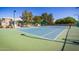 Well-maintained tennis court with net and fencing, perfect for recreational play and exercise at 1777 W Redfield Rd, Gilbert, AZ 85233