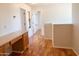 Hallway area featuring wood floors, natural light and multiple doorways at 2873 S Arroyo Ln, Gilbert, AZ 85295
