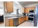 Cozy kitchen featuring stainless steel appliances and light wood cabinetry at 2873 S Arroyo Ln, Gilbert, AZ 85295