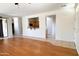Open living space with wood flooring, seamlessly connected to the adjacent spaces and natural light at 2873 S Arroyo Ln, Gilbert, AZ 85295