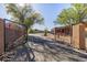 An elegant gated entrance welcomes you to this desert home surrounded by mature trees and desert landscaping at 38516 N 34Th Ave, Phoenix, AZ 85086