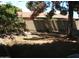 Spacious backyard with a mature tree and block fence for privacy at 4718 W El Caminito Dr, Glendale, AZ 85302