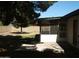 Side exterior view of home featuring patio and backyard at 4718 W El Caminito Dr, Glendale, AZ 85302