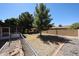 The backyard features a spacious yard with trees and some rock landscaping, perfect for outdoor activities at 4718 W El Caminito Dr, Glendale, AZ 85302