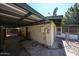 View of backyard area with covered parking, storage and screened in patio at 4718 W El Caminito Dr, Glendale, AZ 85302