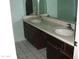 Bathroom features a double sink vanity with tile flooring at 4718 W El Caminito Dr, Glendale, AZ 85302