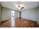An open bedroom area with hard wood floors and easy access to attached bathroom at 4718 W El Caminito Dr, Glendale, AZ 85302