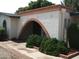 House exterior with brick archway and landscaped bushes at 4718 W El Caminito Dr, Glendale, AZ 85302