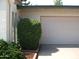 Garage exterior with lovely landscaped bushes at 4718 W El Caminito Dr, Glendale, AZ 85302