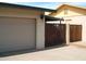 Garage with access to a fenced side yard at 4718 W El Caminito Dr, Glendale, AZ 85302