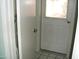 Hallway with door leading outside and tile floors at 4718 W El Caminito Dr, Glendale, AZ 85302